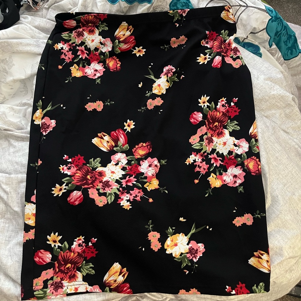Black pencil skirt with floral patterns around